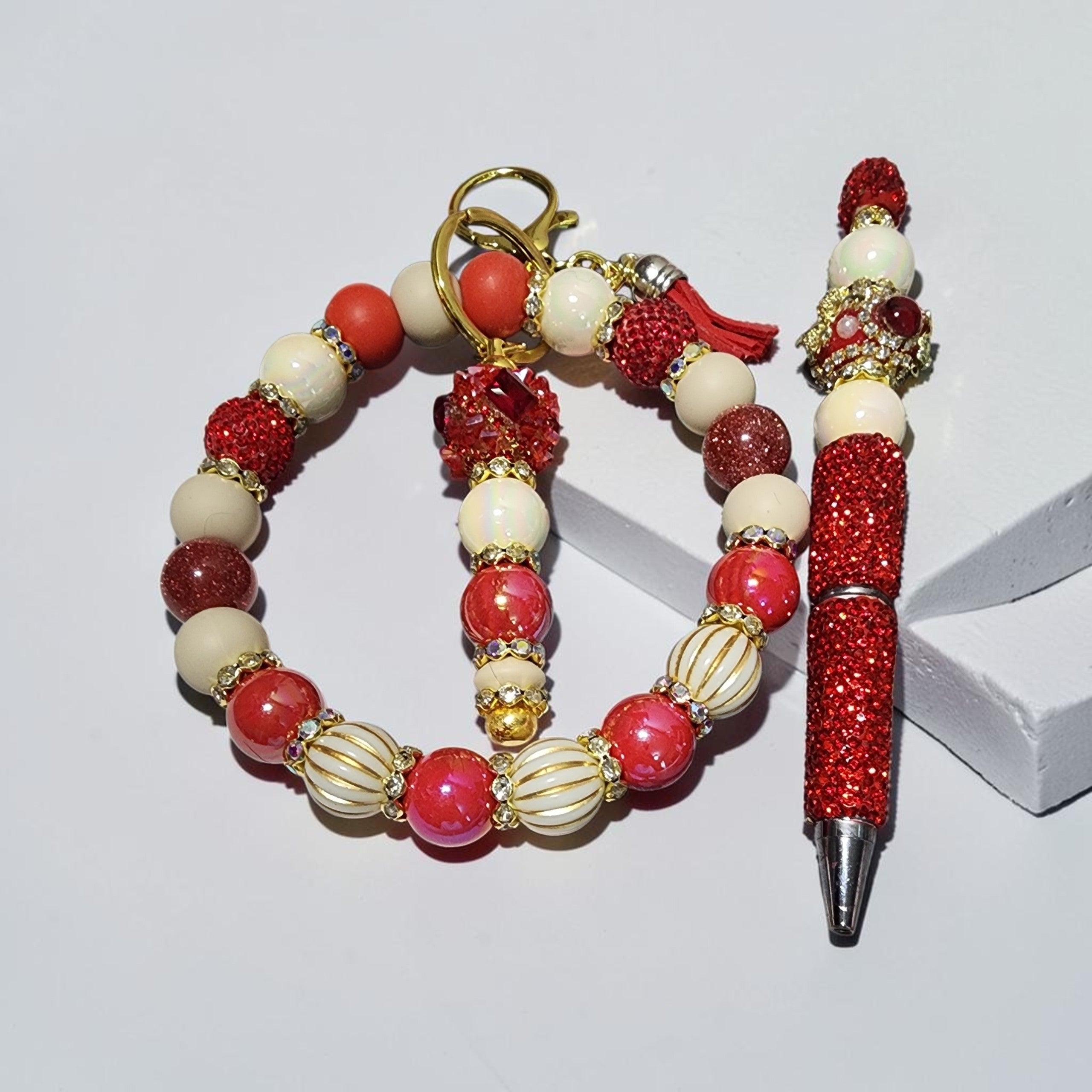 Blessed Bead worx handcrafted red, white, and gold beaded pen and keychain set with sparkling glitter accents.