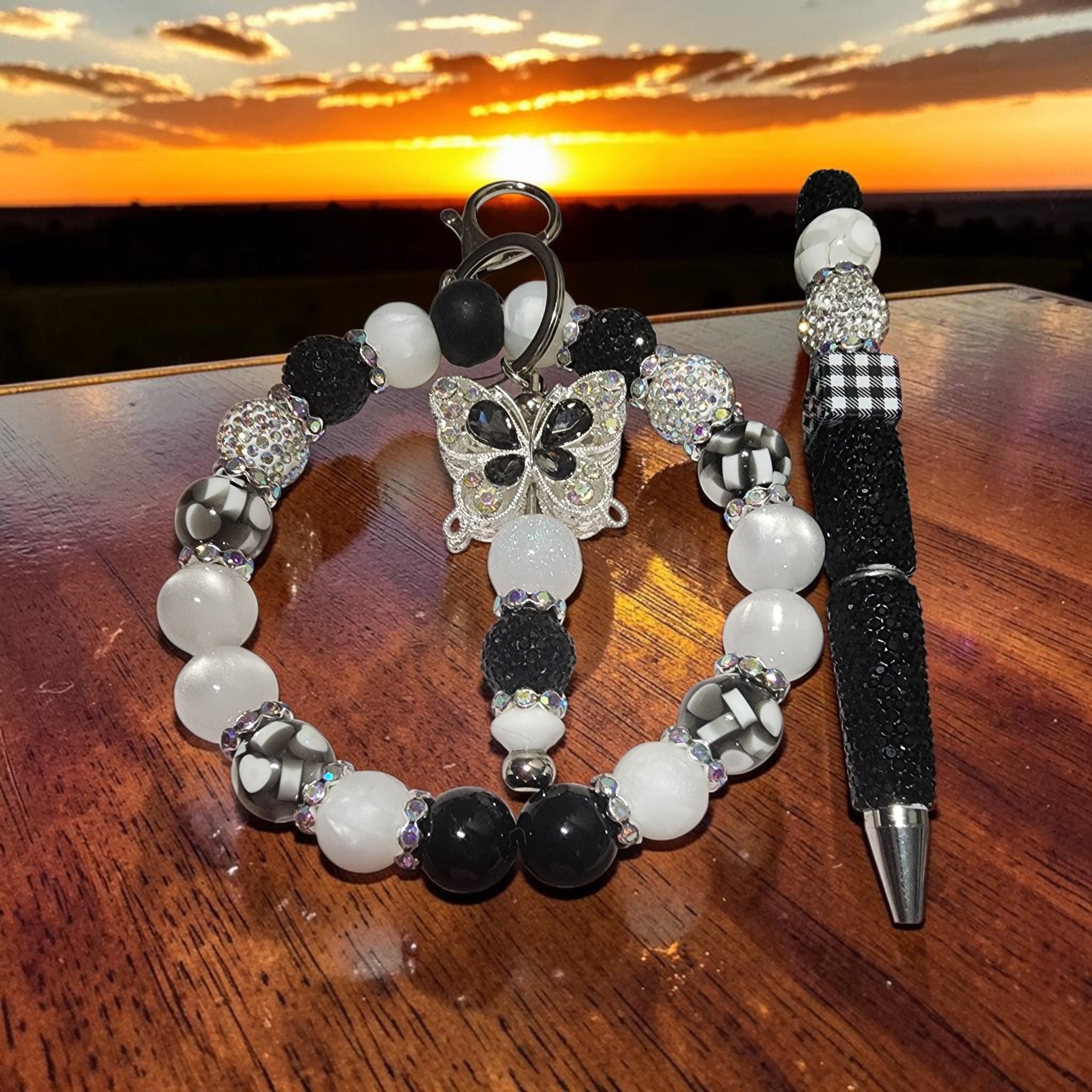 Blessed Bead worx beaded keychain and matching pen set in black, white, and silver with a butterfly charm.
